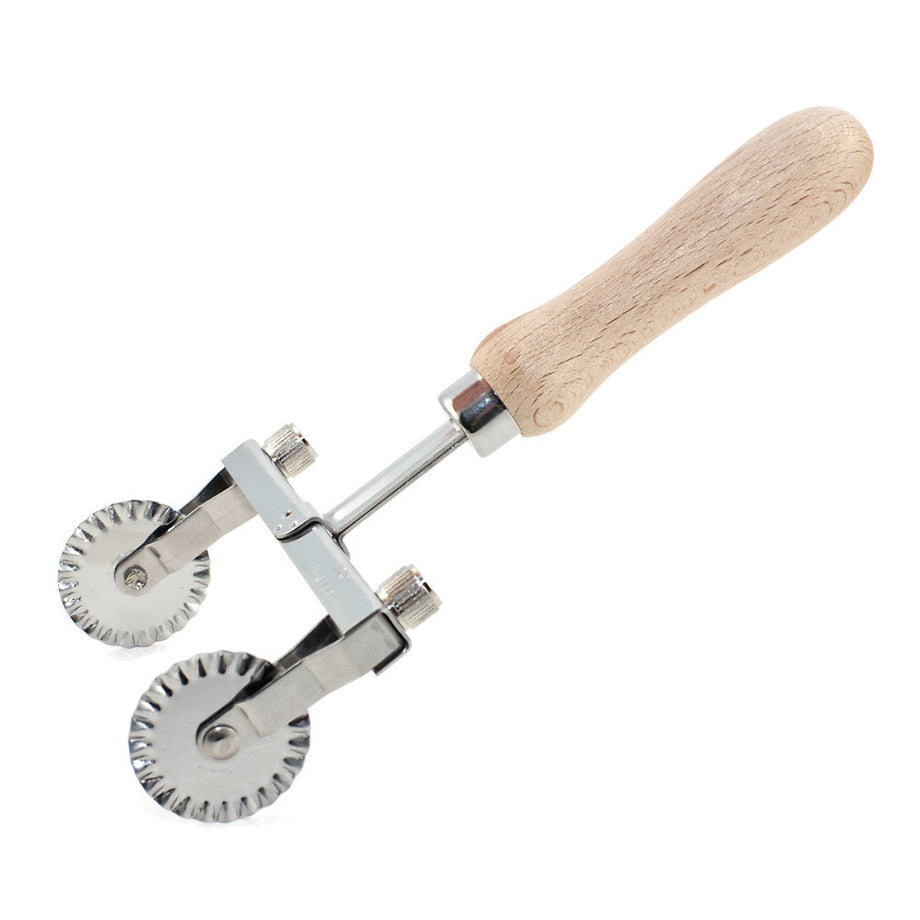 https://www.italiancookshop.com/cdn/shop/products/Traditional-homemade-pasta-tool-adjustable-two-wheel-pasta-cutter-zigzag-edge_460x@2x.jpg?v=1647518046