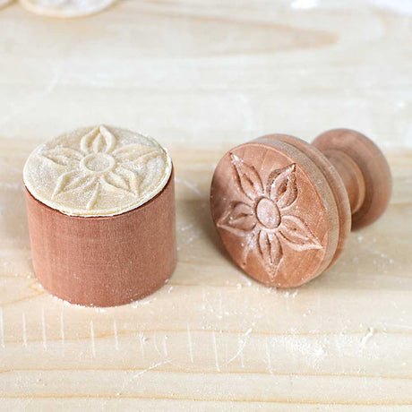 Flower corzetti stamp pattern on pasta