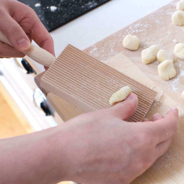 rolling gnocchi on a gnocchi board