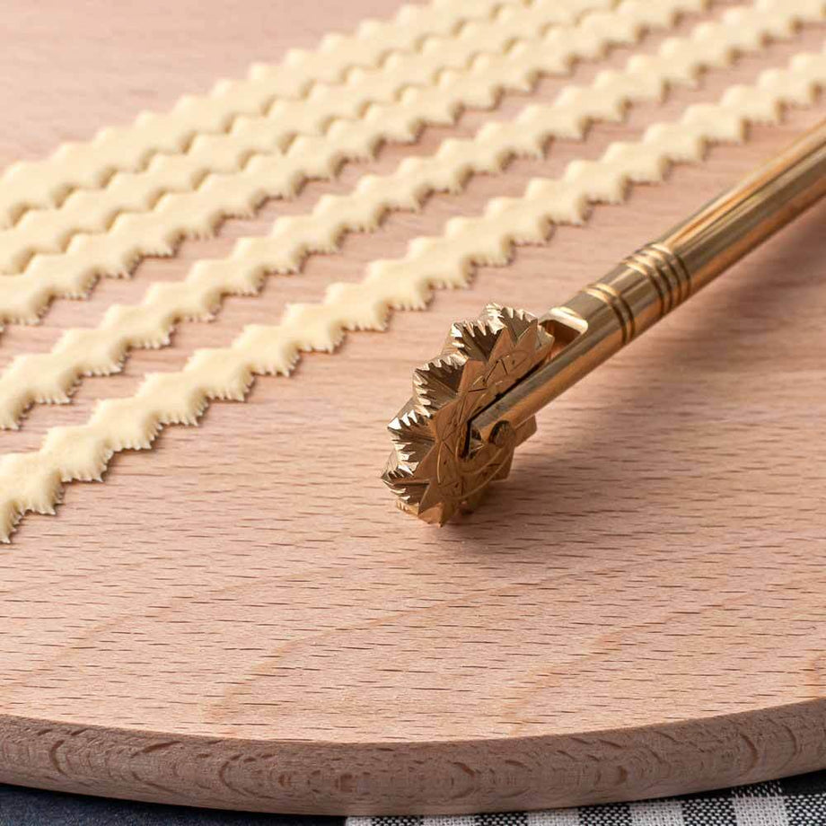 https://www.italiancookshop.com/cdn/shop/products/sardinian-pasta-wheel-cutter-no22-2_460x@2x.jpg?v=1662744778